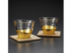 A pair of teacups with coasters - gold leaf glassware
